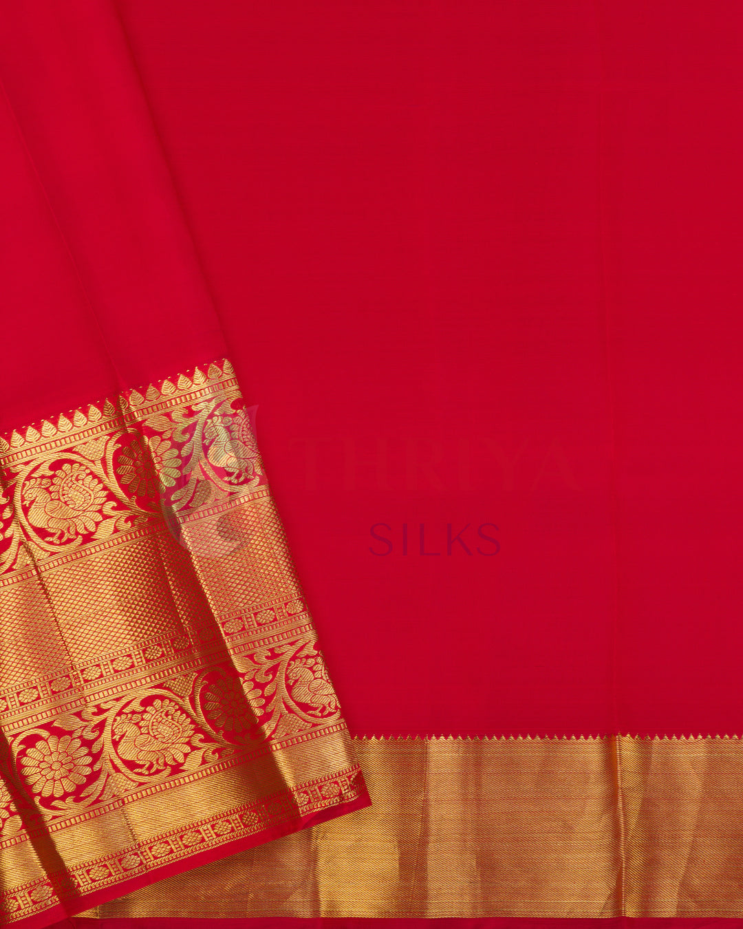 Plain red blouse piece of Kanjivaram silk saree with gold zari border