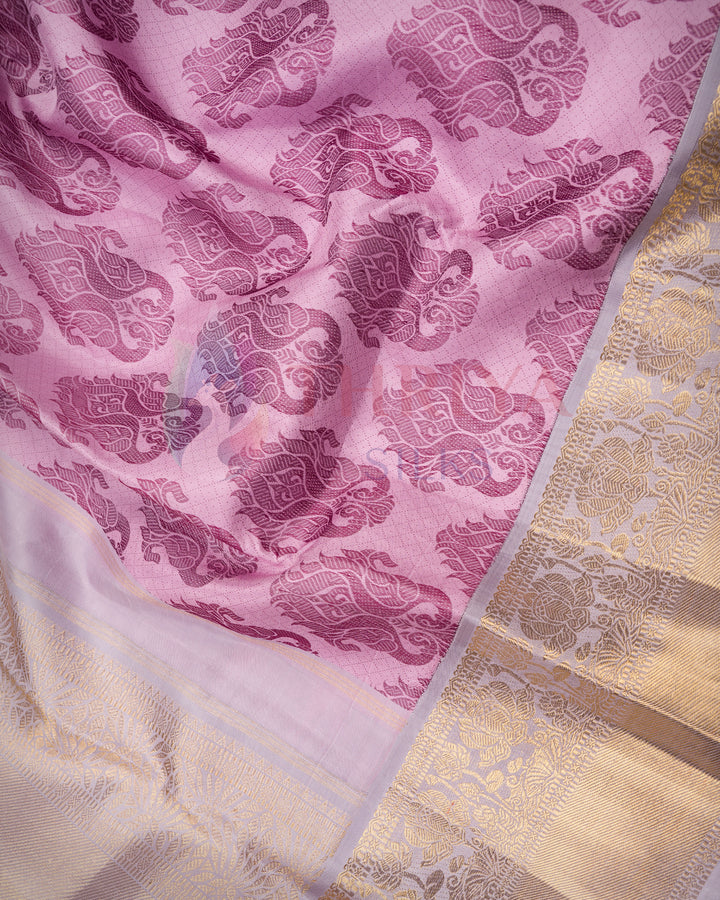 Close-up of magenta floral Kanjivaram silk saree with intricate gold zari border – Thriya Silks