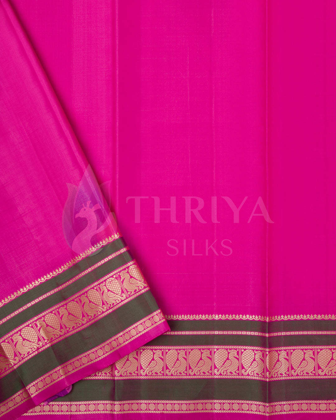 Rich pink blouse piece with olive green and gold zari border, complements the cream saree from Thriya Silks