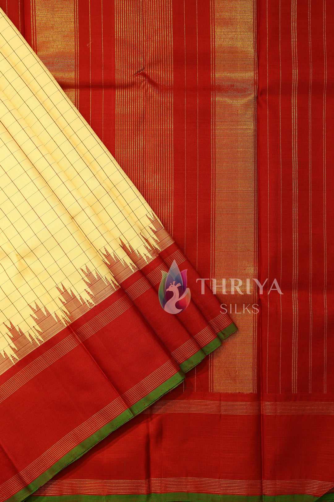 Elegant red pallu with vertical zari stripes on cream-checked saree