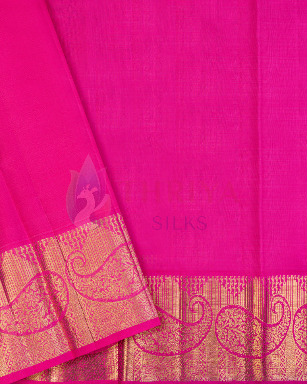 Bright pink silk blouse piece with golden paisley zari border matching turquoise blue Kanjivaram saree