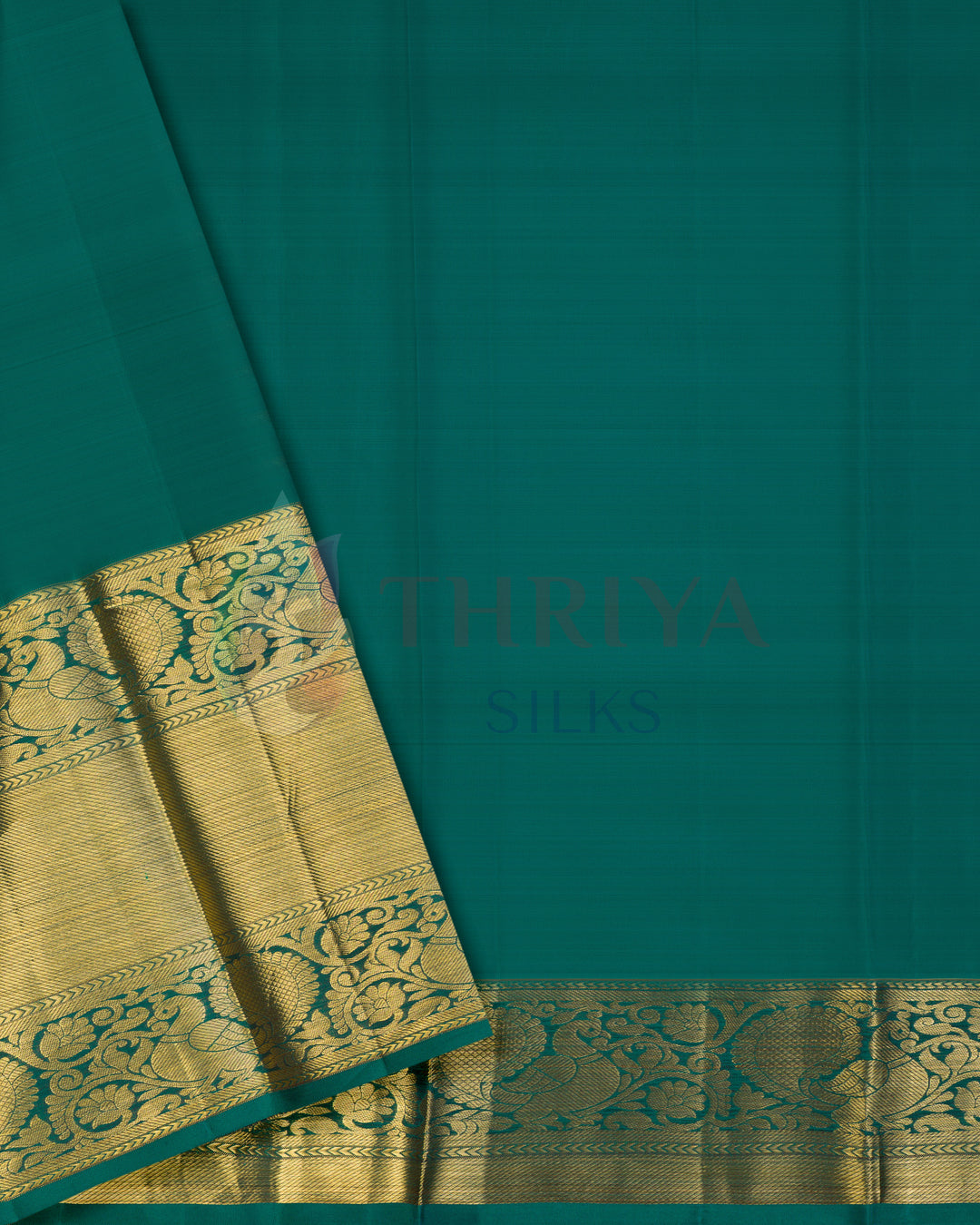 Plain green blouse piece with intricately woven golden zari border – Kanchipuram saree