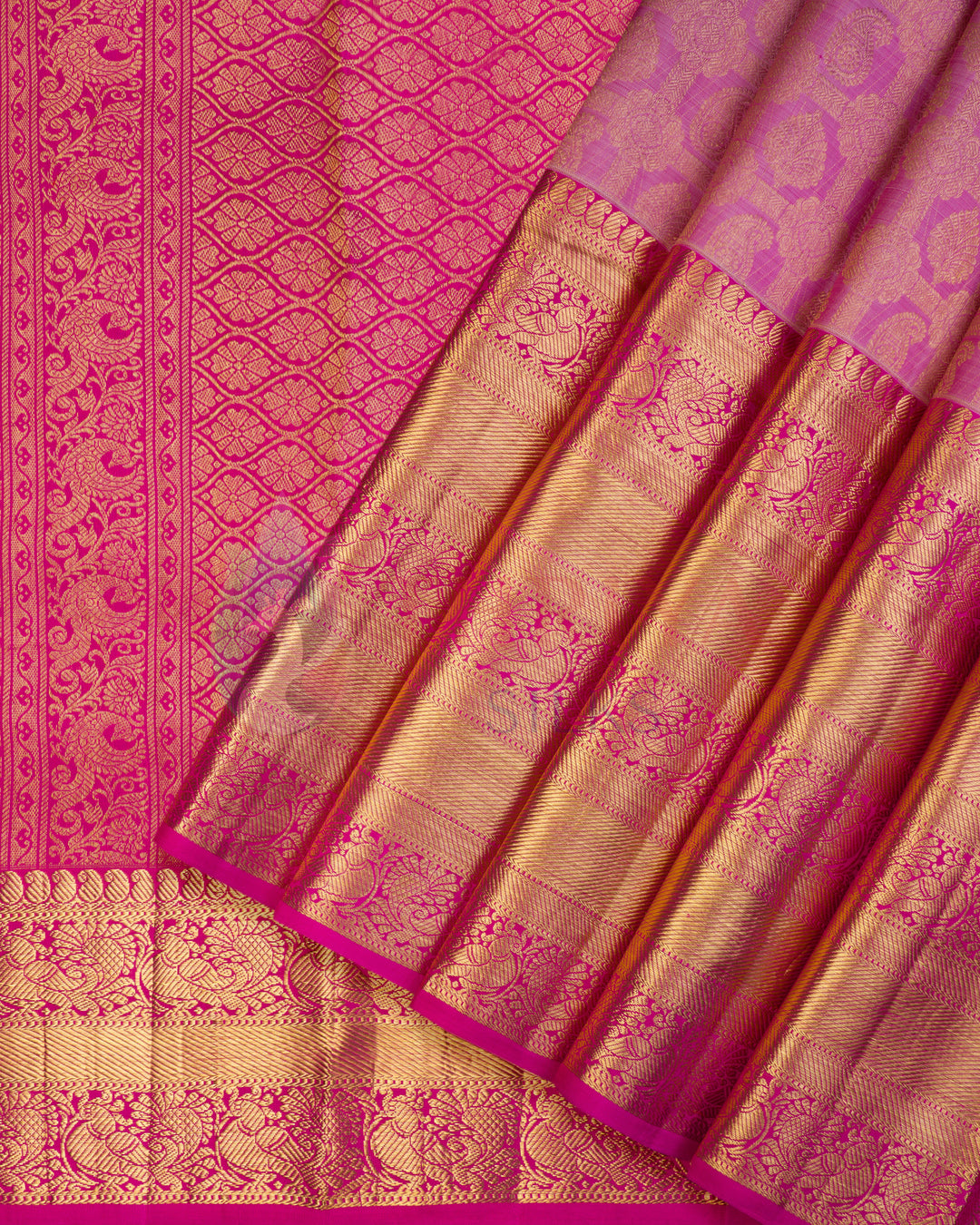 Pink Kanjivaram silk saree with intricate golden zari floral motifs and diamond pattern border
