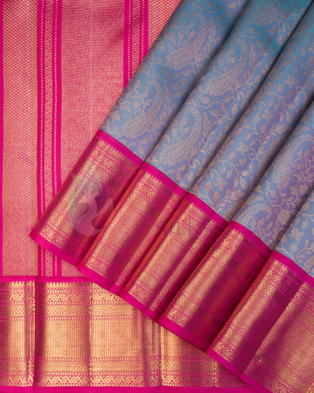 Pastel blue Kanjivaram silk saree with bright pink and gold zari floral and temple design border