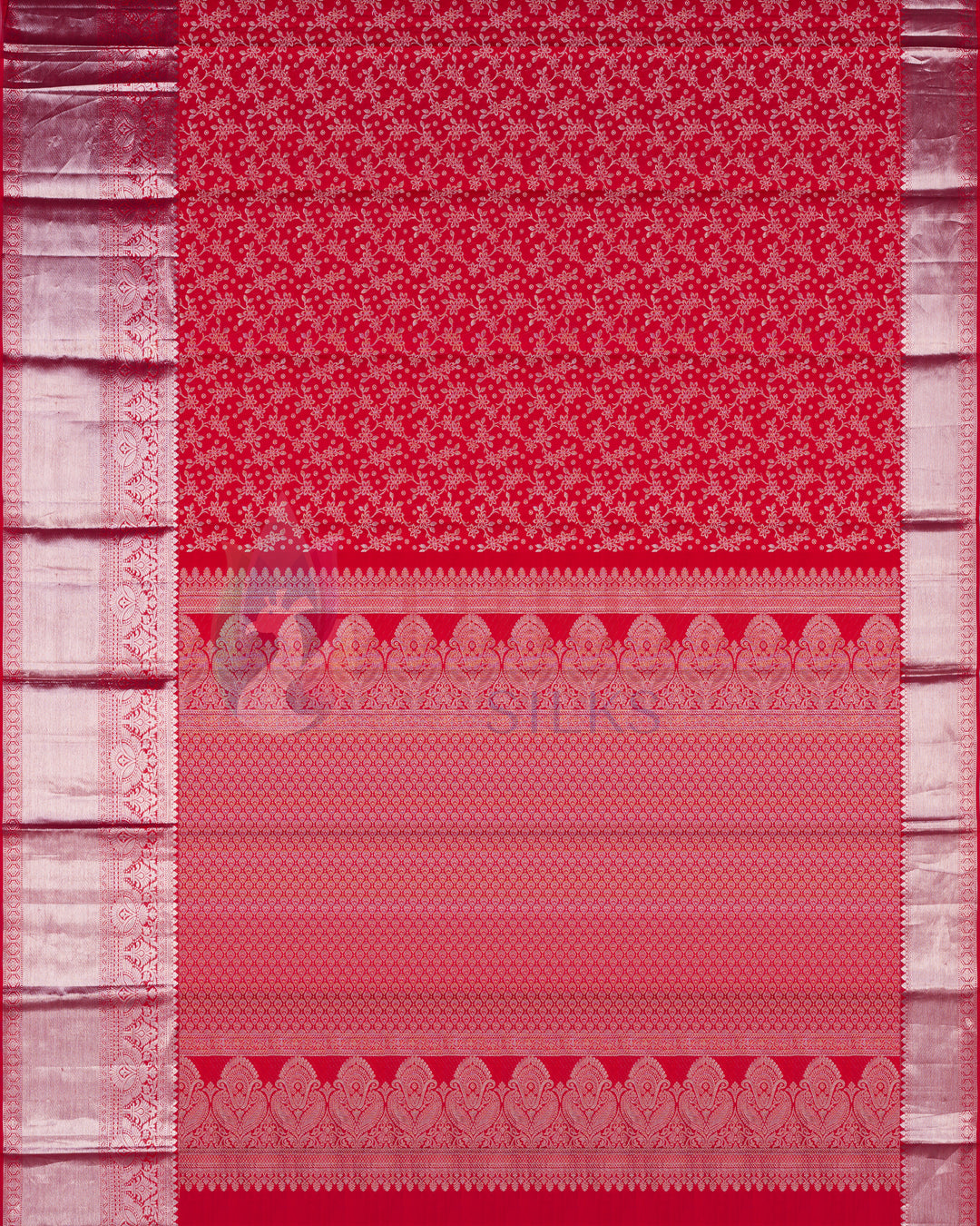 Full view of red Kanjivaram silk saree featuring heavy silver zari work on pallu and border