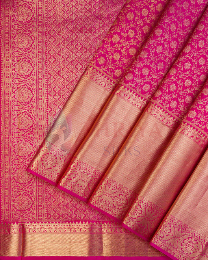Rani pink Kanjivaram silk saree with copper zari floral jaal and traditional motifs