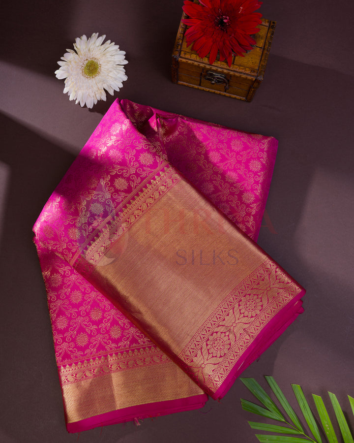 Folded pink floral zari Kanjivaram silk saree – wedding silk saree styled shot