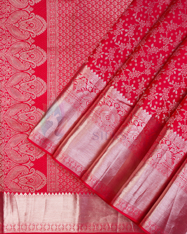 Bright red Kanjivaram silk saree with silver zari floral and elephant motifs on pallu