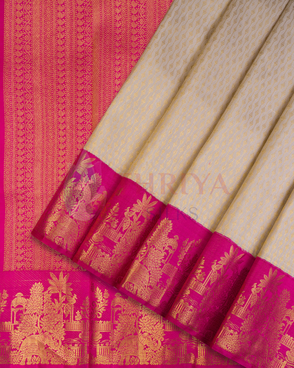 Off-white Kanjivaram silk saree with intricate golden zari floral motifs and vibrant pink border with temple designs