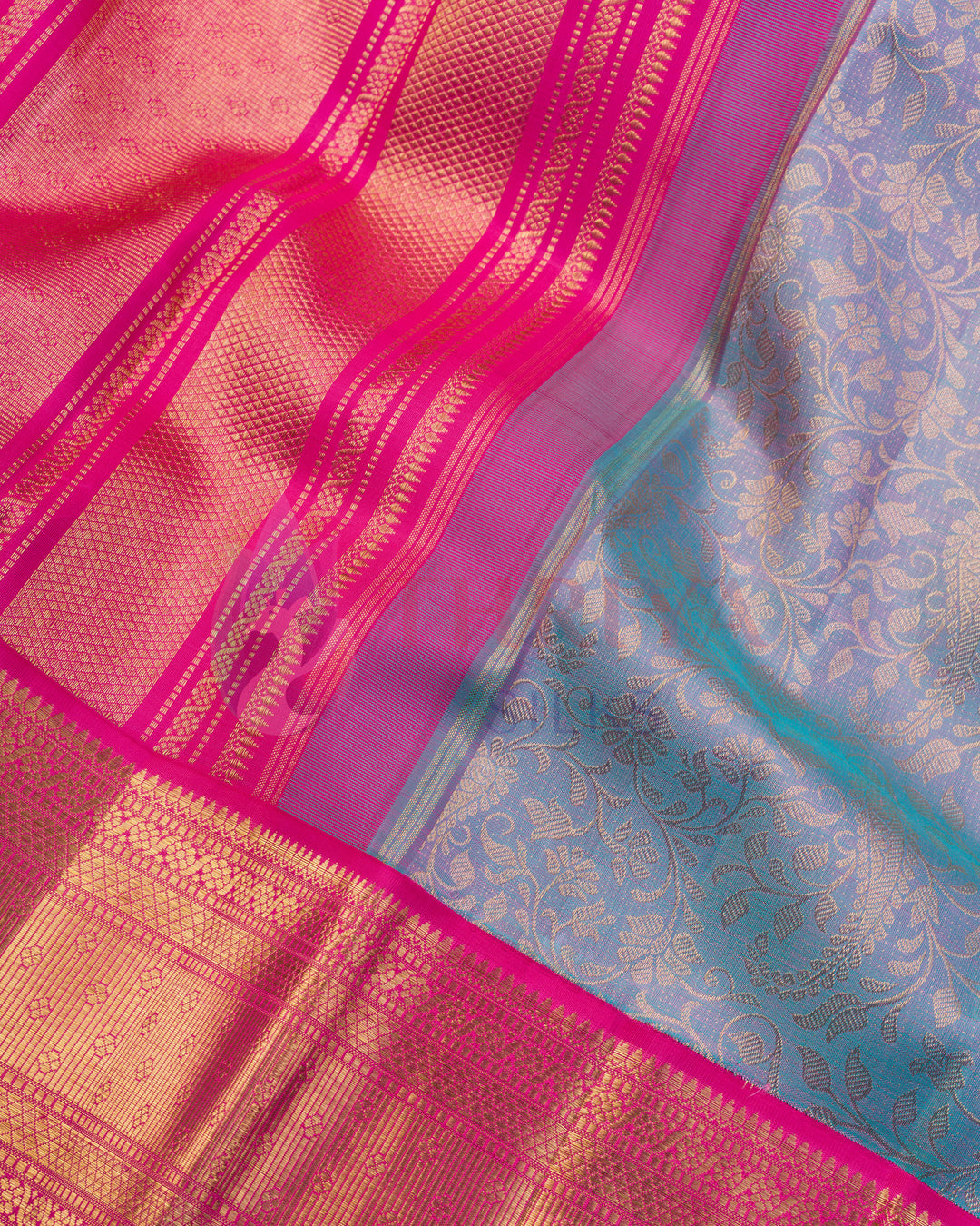 Bright pink zari floral border on pastel blue Kanjivaram silk saree
