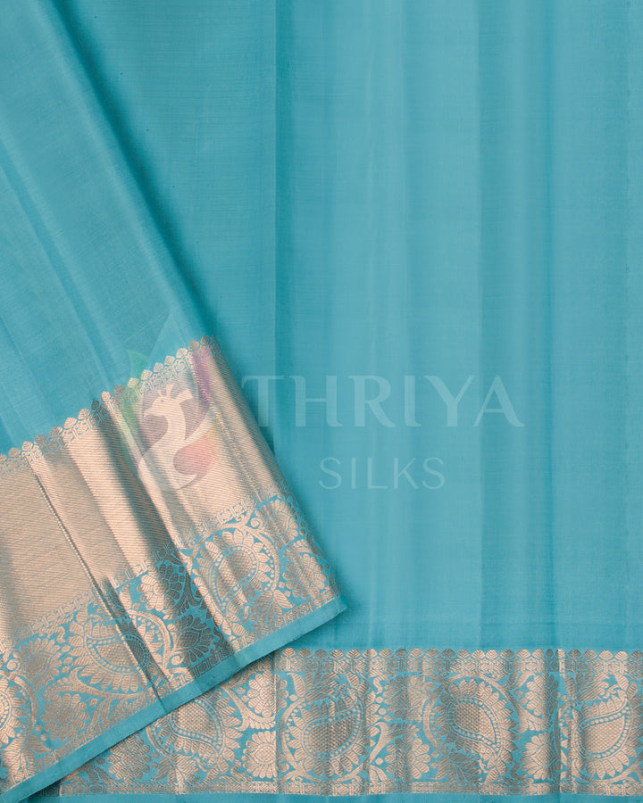 Plain aqua blue blouse piece with silver zari border for contrast.