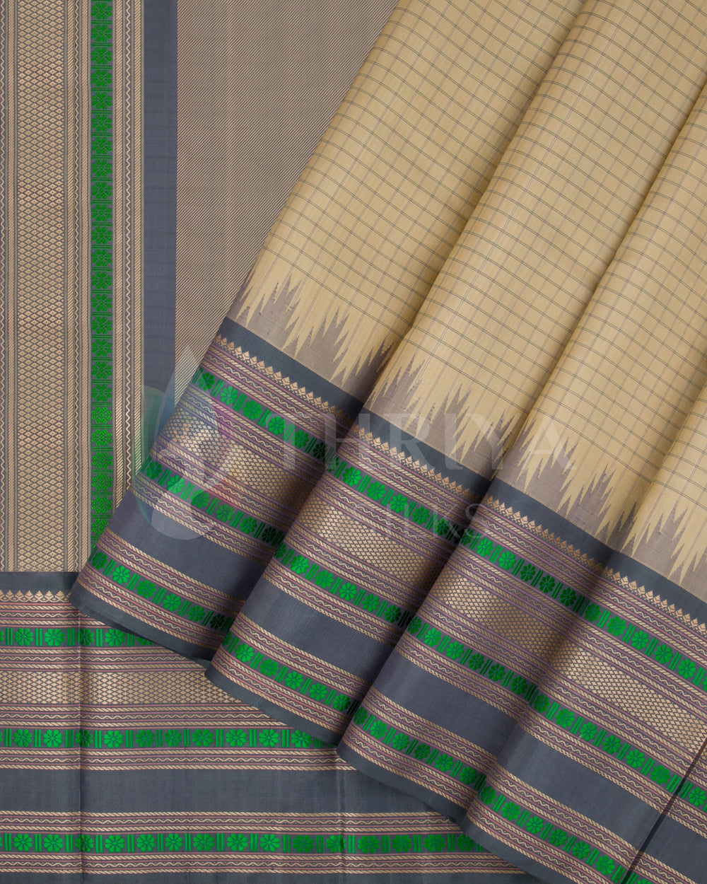 Beige and grey silk saree with green and gold zari border – front pleated view from Thriya Silks