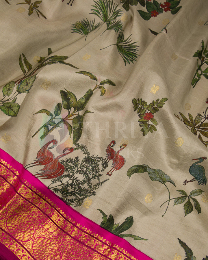 Detailed view of flamingo and foliage motifs on beige silk body with a striking pink zari border.