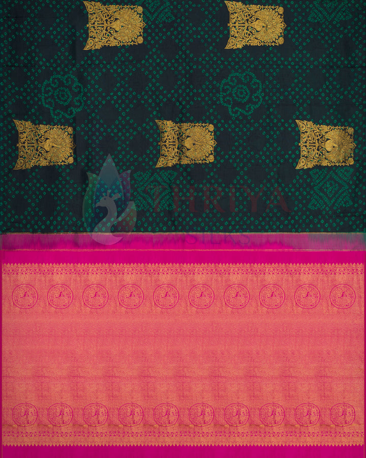Black and green Kanchipuram silk saree with intricate pink zari border and golden motifs