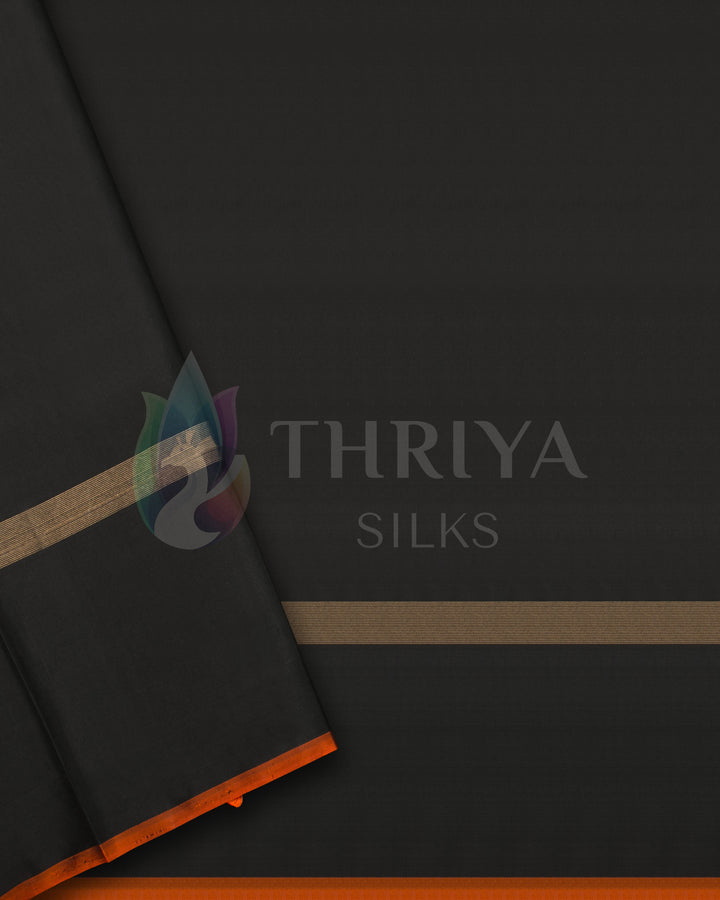 Black blouse piece with gold zari lines and orange piping from the temple border silk saree