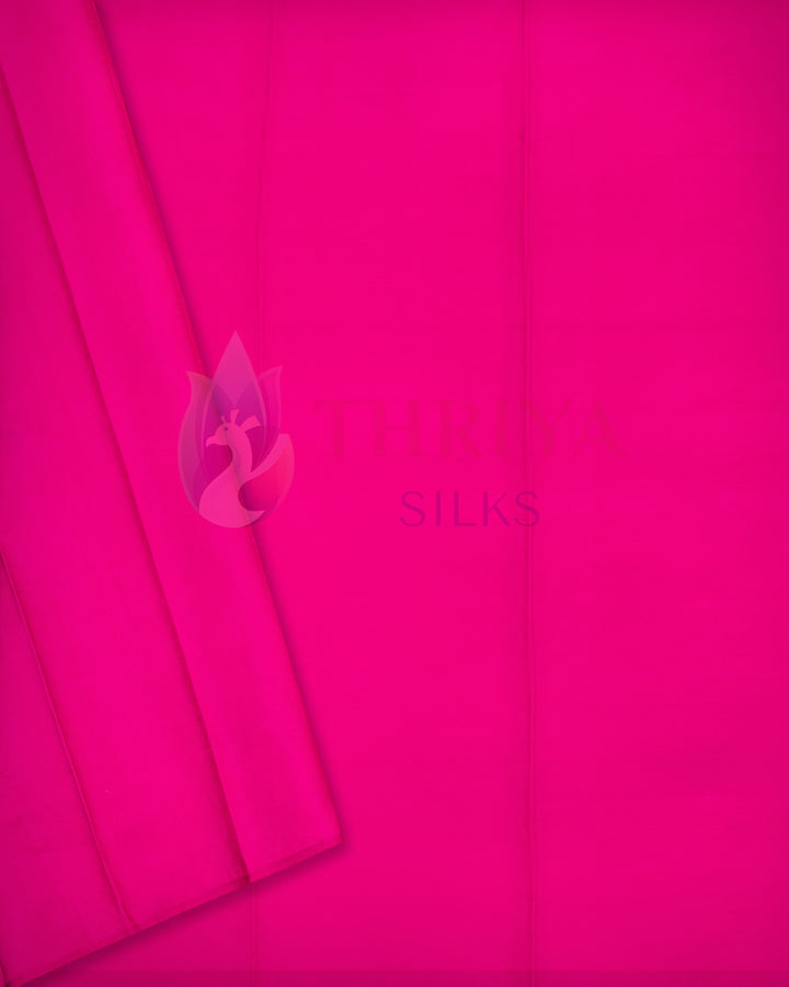 Bright pink plain Kanchipuram silk saree with subtle texture