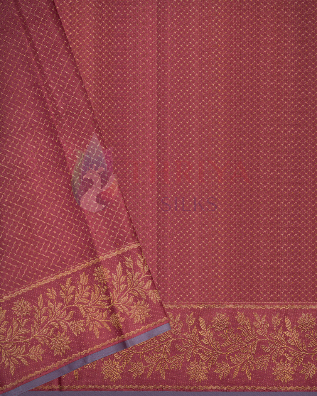 Close-up of red Kanjivaram silk saree with floral weaving and contrast blue zari border – handcrafted by Thriya Silks