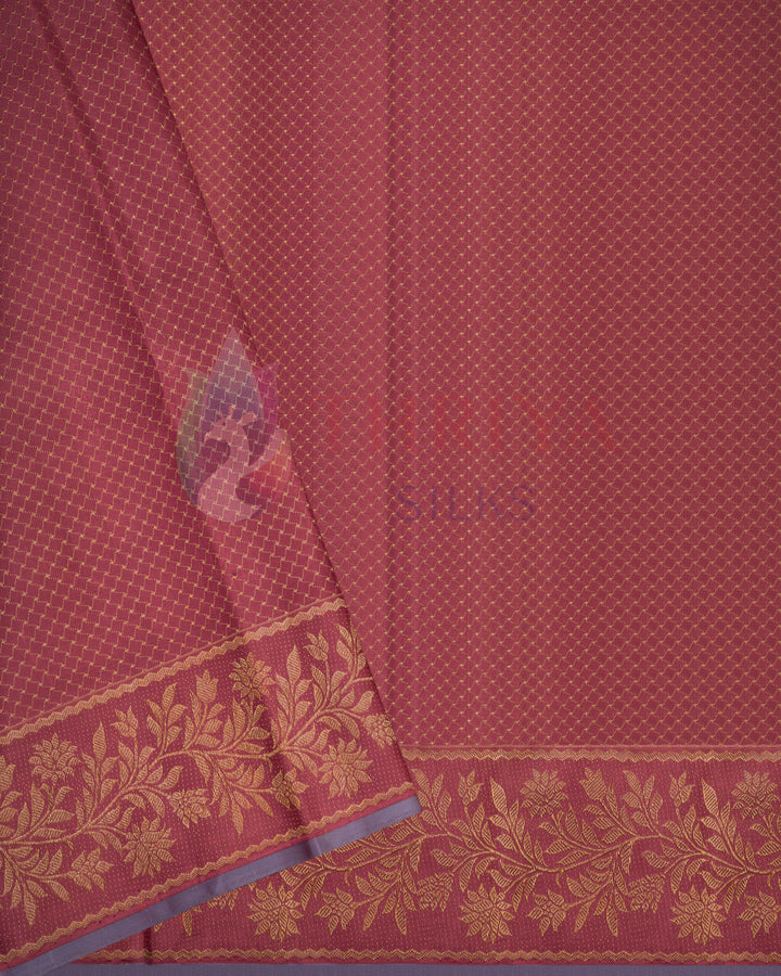 Close-up of red Kanjivaram silk saree with floral weaving and contrast blue zari border – handcrafted by Thriya Silks