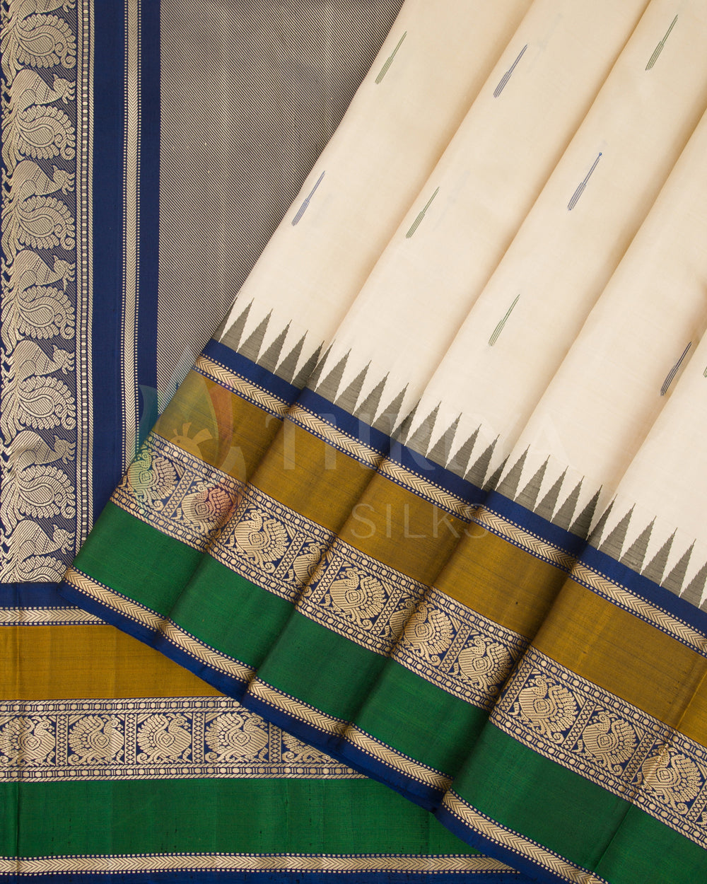 Cream silk saree pleats with rich blue, green, and gold borders featuring intricate zari designs, from Thriya Silks

