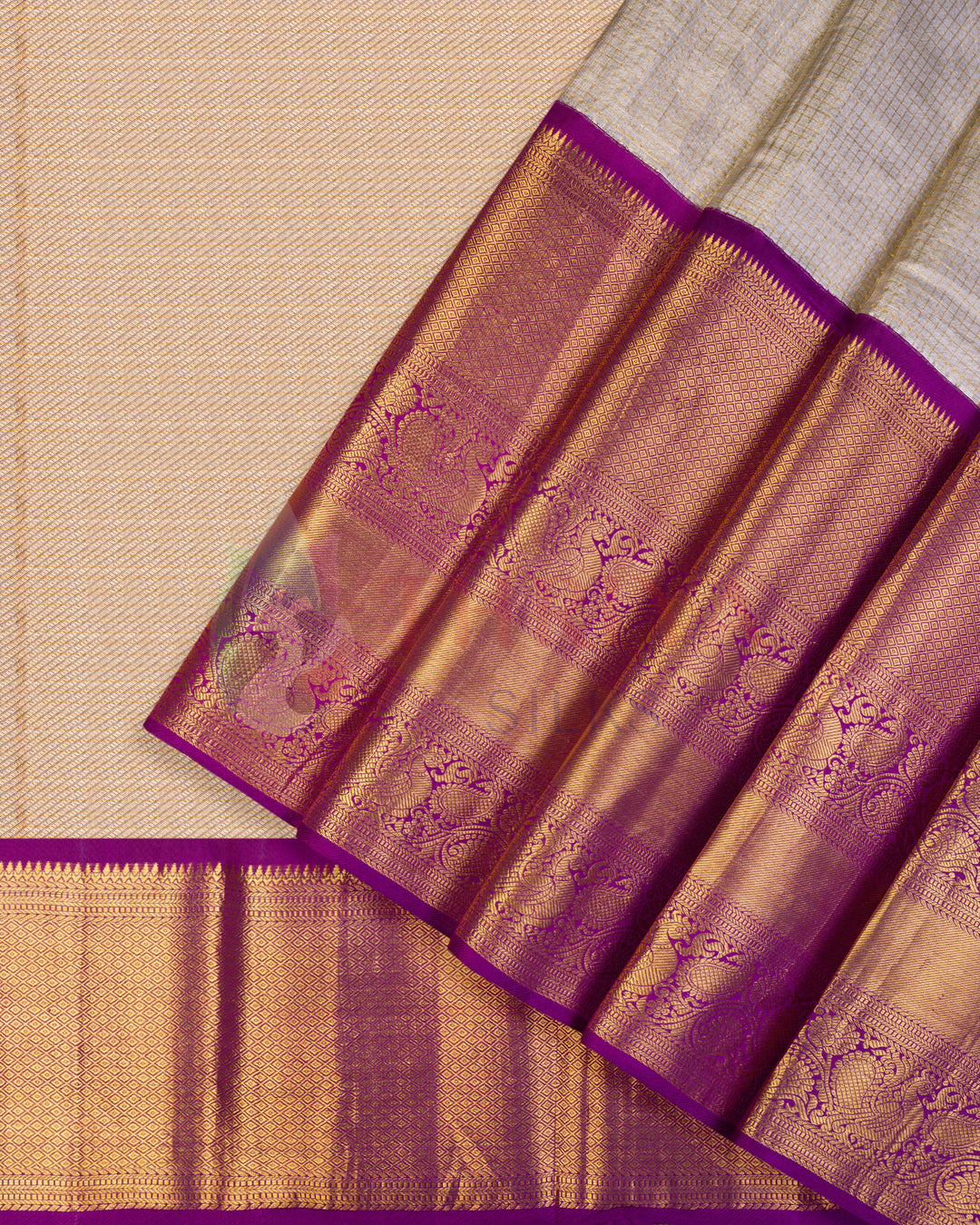 Cream Kanjivaram silk saree with golden body weave and rich purple zari pallu and border