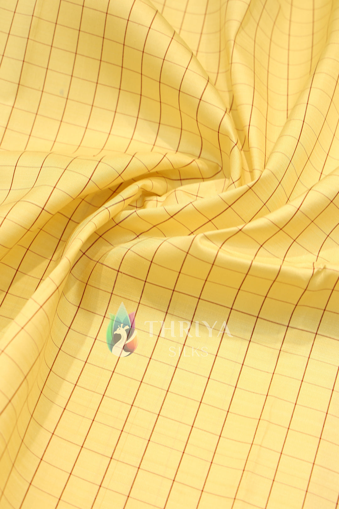  Cream silk saree body featuring neat red check patterns.