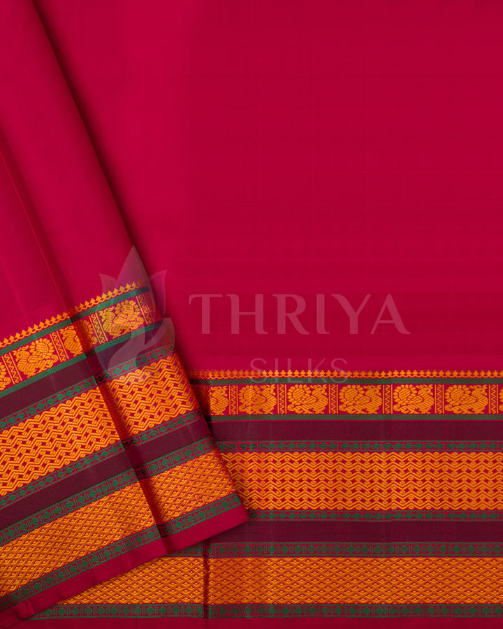 Deep pink silk blouse piece matching the cream saree with orange and gold border, from Thriya Silks