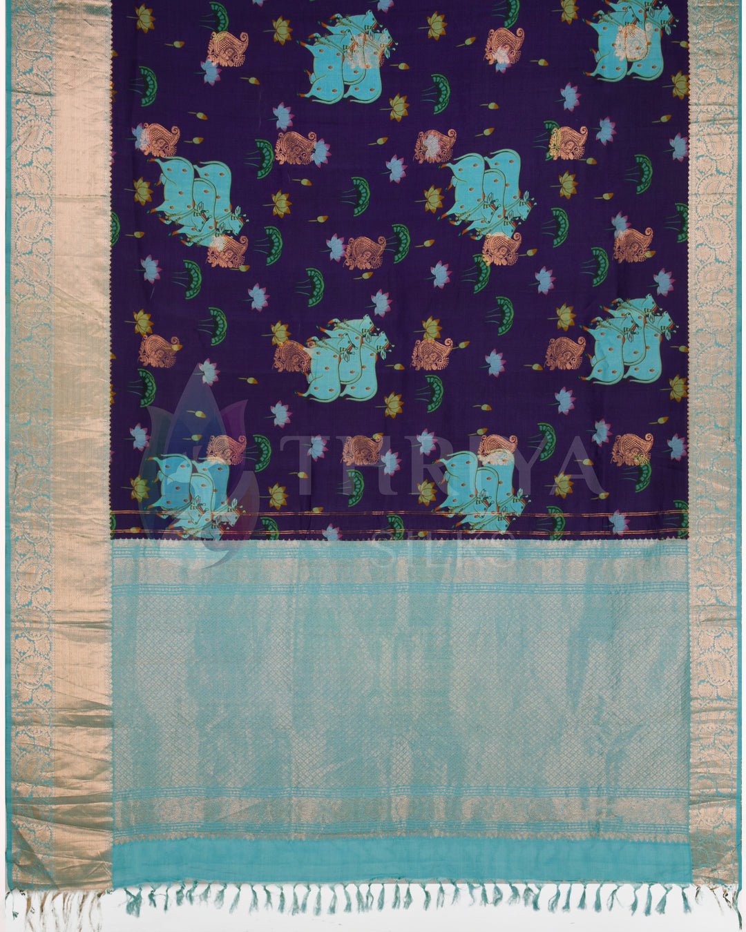Full pallu view with vibrant elephant and lotus motifs on purple body and aqua silver zari end.