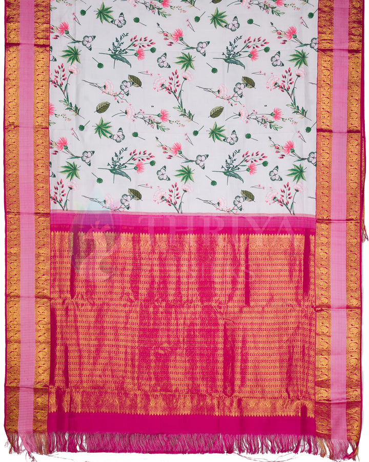 Full view of Kanchipuram silk saree with white floral printed body, vibrant pink pallu, and intricate gold zari work.