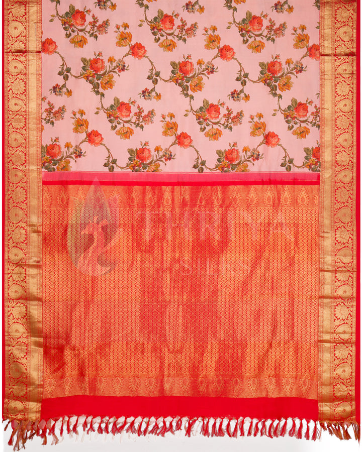 Full view of the saree featuring floral digital prints on pink silk with red pallu and golden zari weaving.