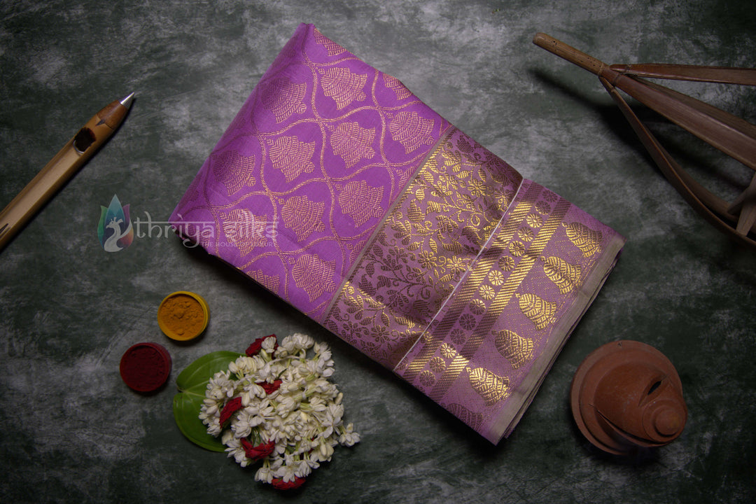 Folded lavender silk saree with diamond brocade zari work 