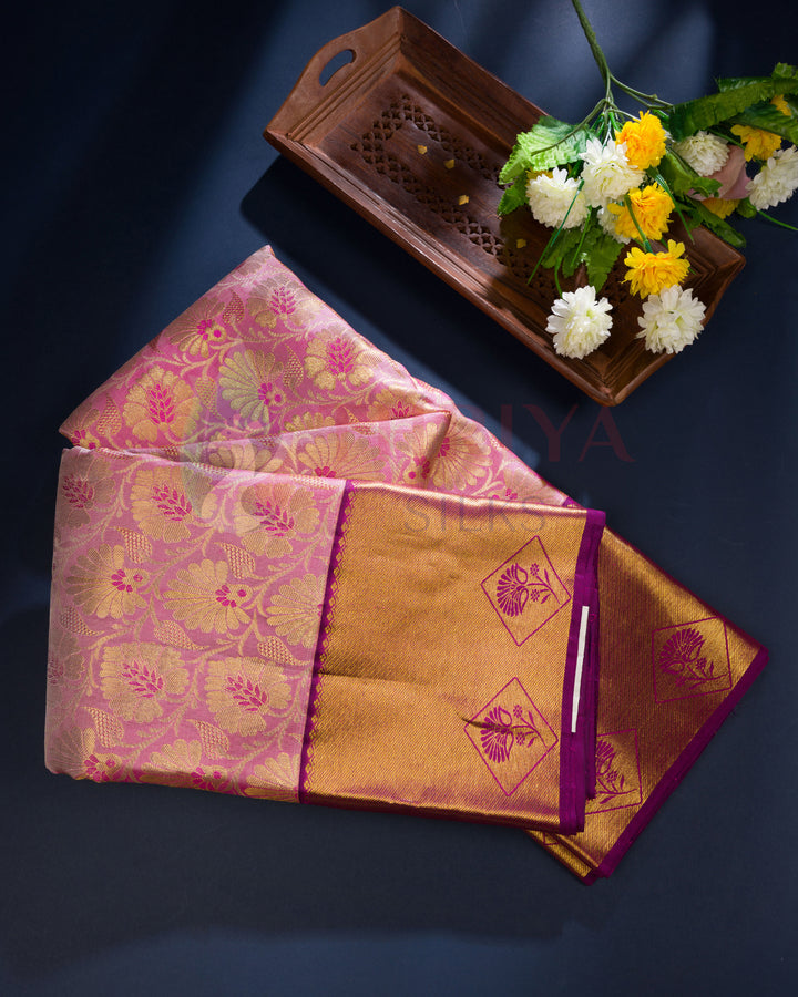 Folded Kanjivaram silk saree in magenta with golden zari pallu – premium handloom silk saree