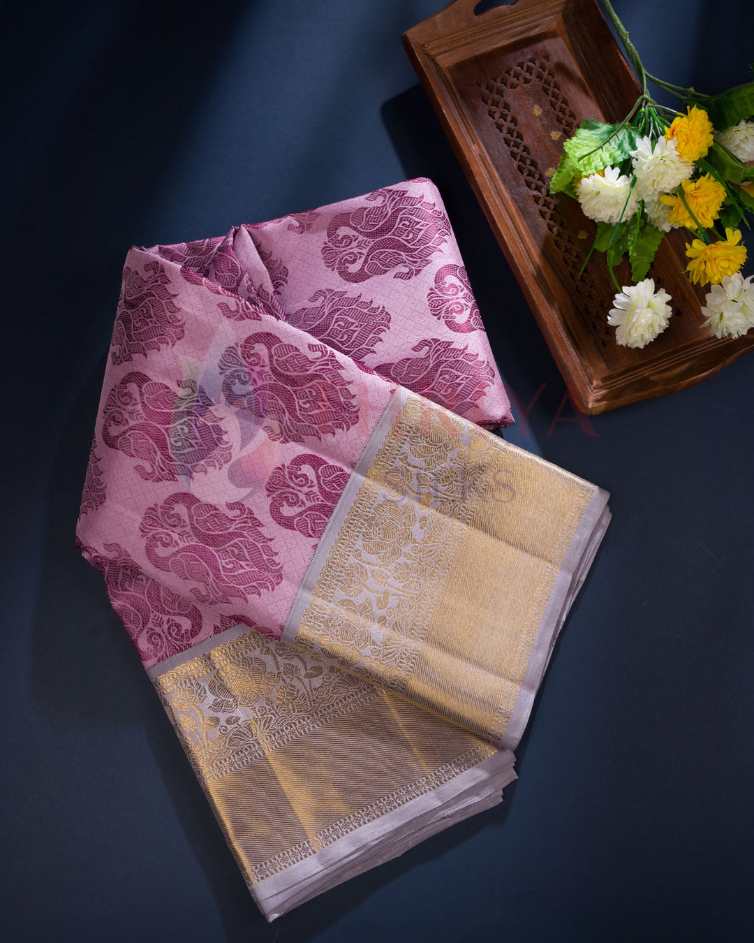 Folded magenta silk saree with traditional floral zari border – Thriya Silks