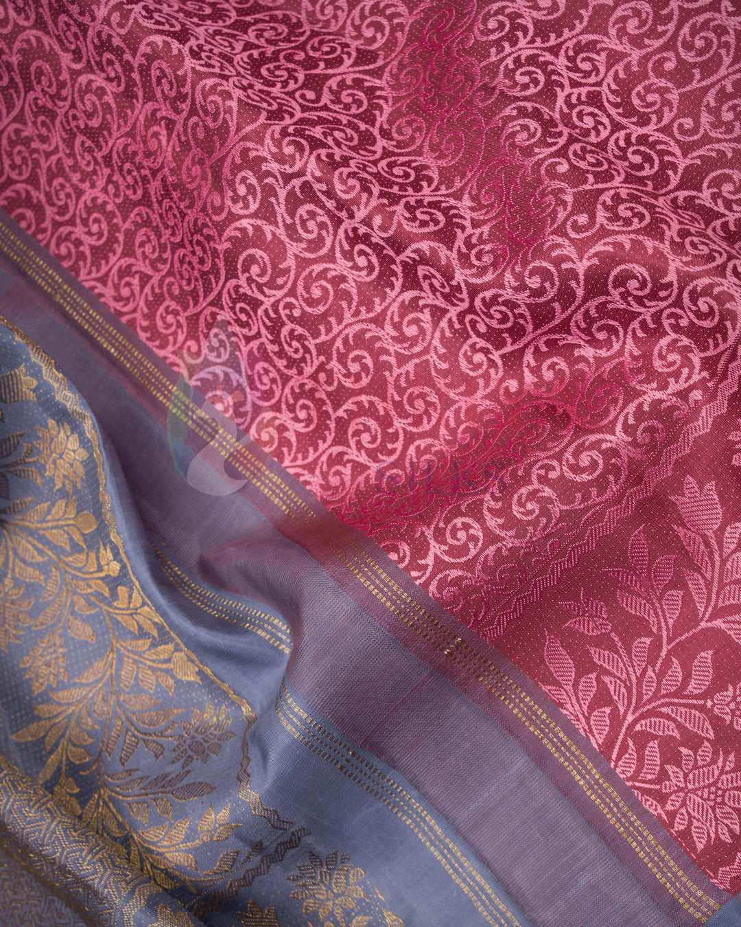Folded peach Kanjivaram silk saree with shimmering copper zari border – elegant silk by Thriya Silks