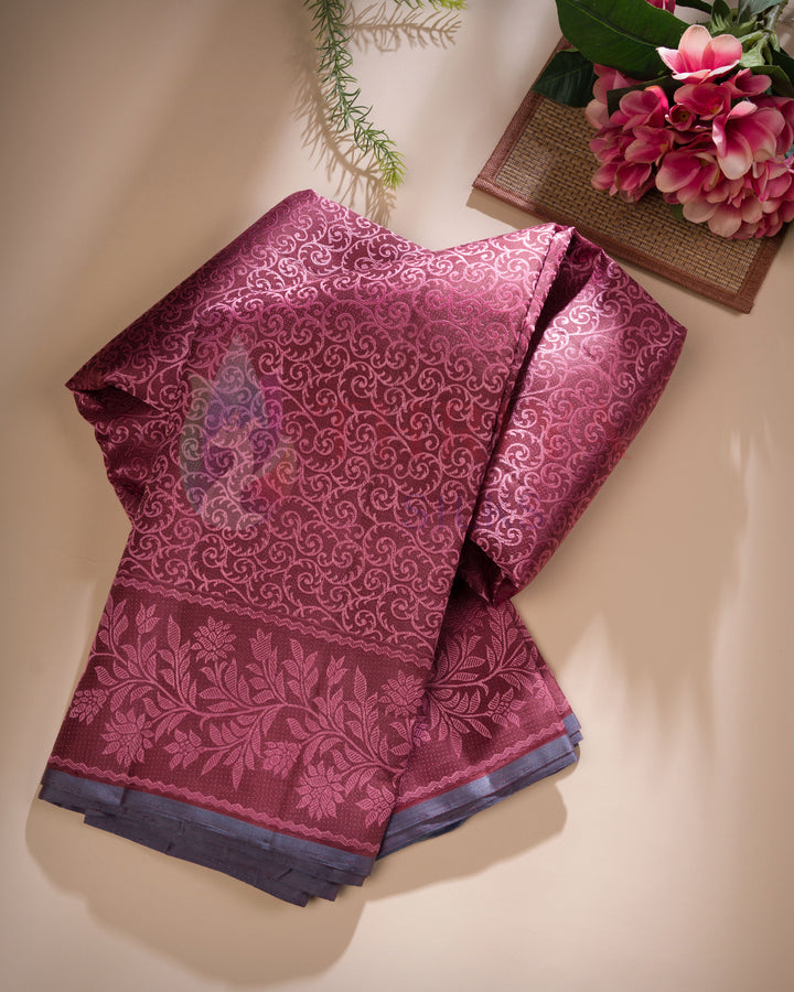 folded red Kanjivaram silk saree with intricate floral motifs and contrast blue zari pallu – Thriya Silks