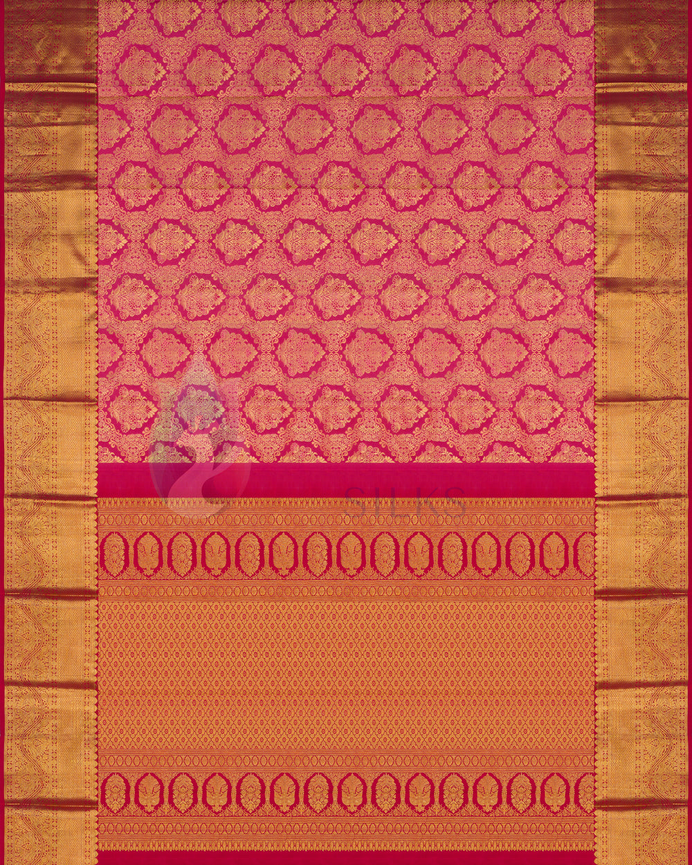 Full layout of rust Kanjivaram silk saree with gold zari border and traditional temple motifs