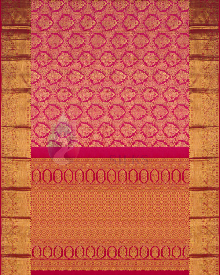 Full layout of rust Kanjivaram silk saree with gold zari border and traditional temple motifs