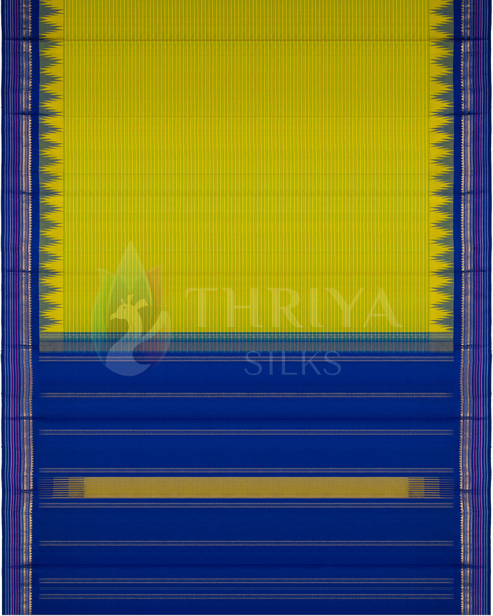 Full layout of yellow-green silk saree with blue pallu and golden border, Thriya Silks