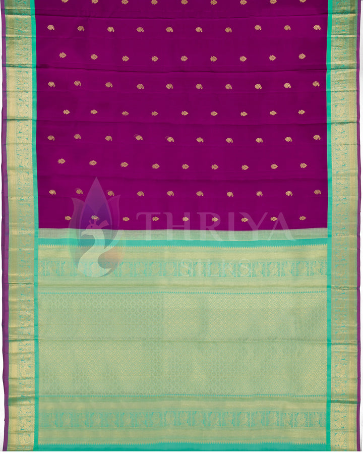Full layout of Thriya silk saree with woven purple body, gold motifs, and contrasting green zari pallu