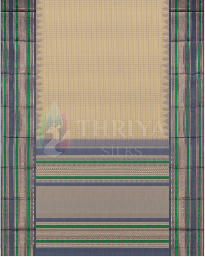 Full layout of beige silk saree with bold green and grey zari detailing – traditional design from Thriya Silks