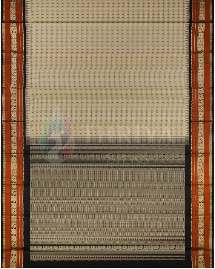 Full layout of beige silk saree with ornate rust and black pallu design from Thriya Silks