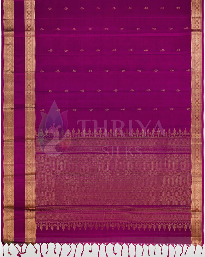 Full view of magenta Kanjivaram saree with traditional golden zari weave
