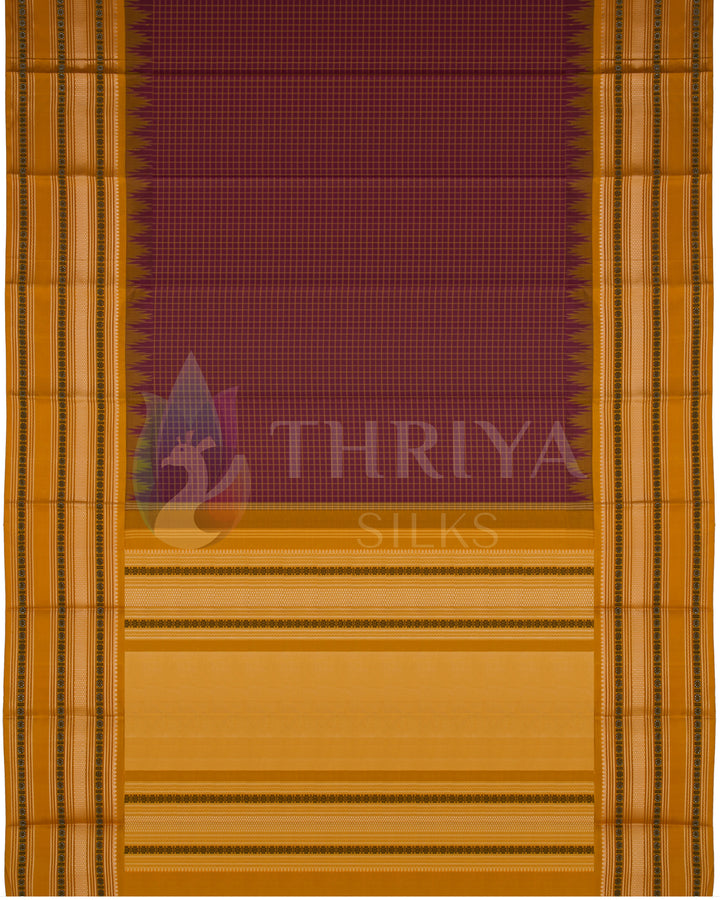 Full layout of maroon and mustard yellow Kanjivaram silk saree with contrast temple border