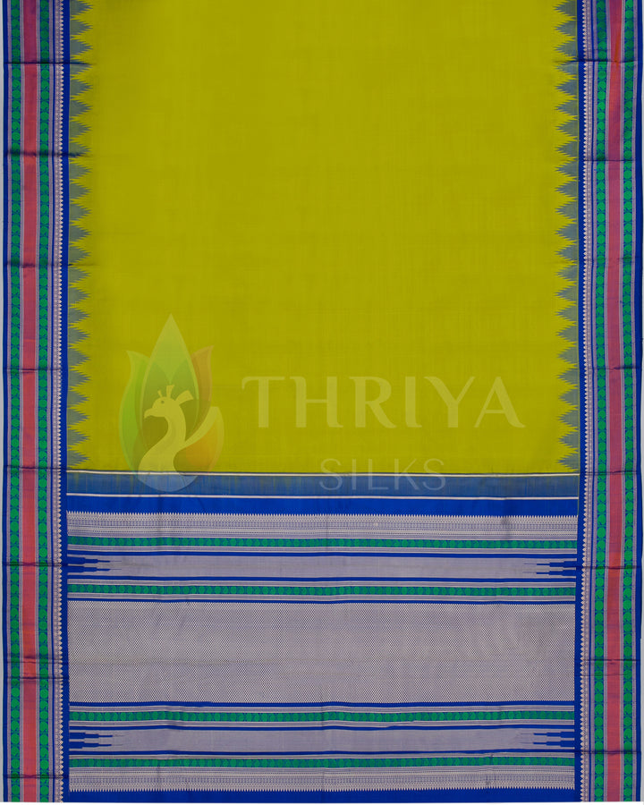 ull view of the saree pallu showing lime green body with silver and blue zari patterns and striped border.