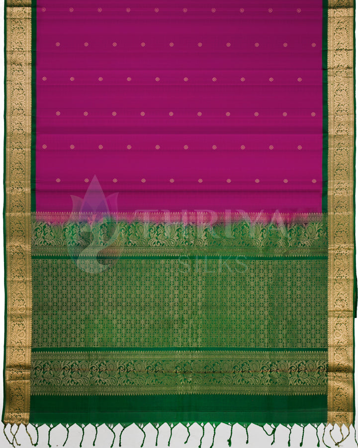 Complete view of purple Kanjivaram saree with green border and golden zari work