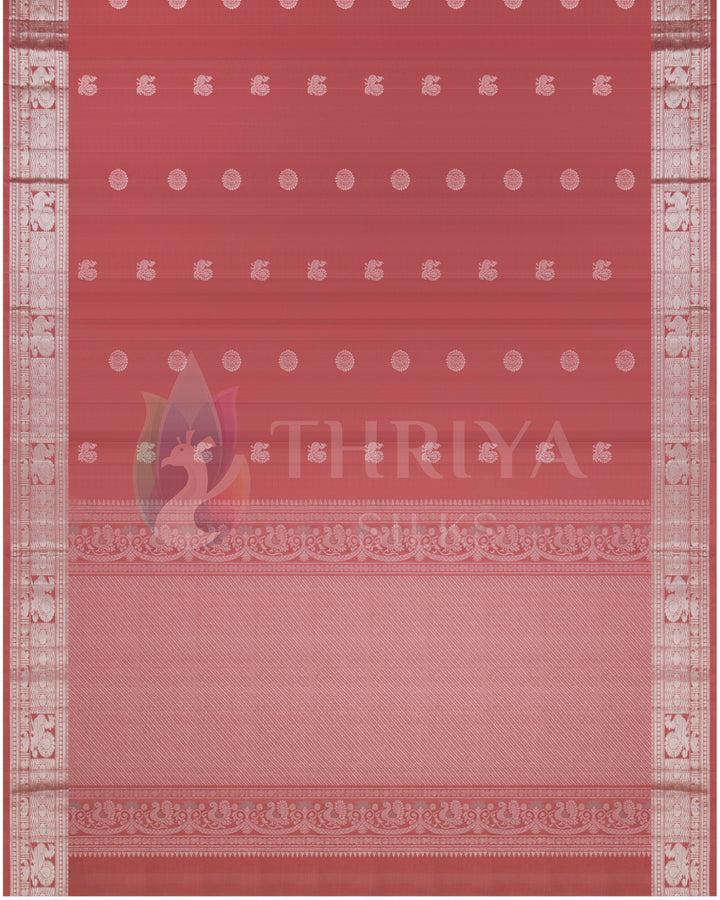Full view of dusty rose Kanjivaram saree with silver zari work and motifs