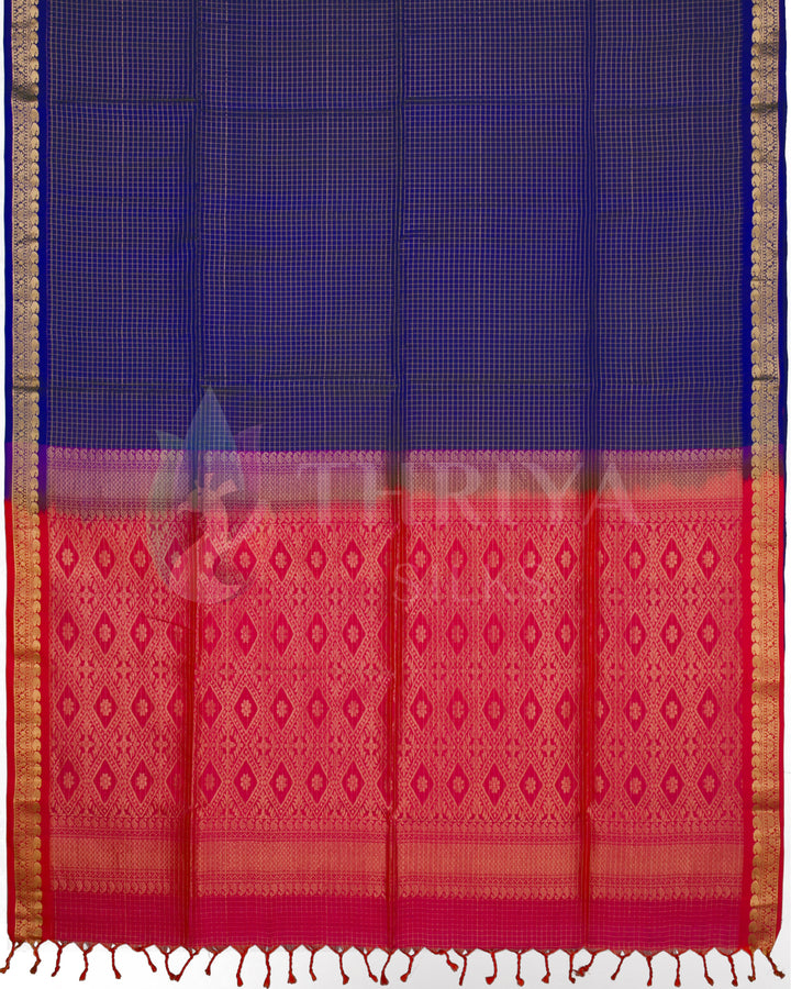 Full layout of royal blue Kanjivaram saree with vibrant red pallu and woven motifs