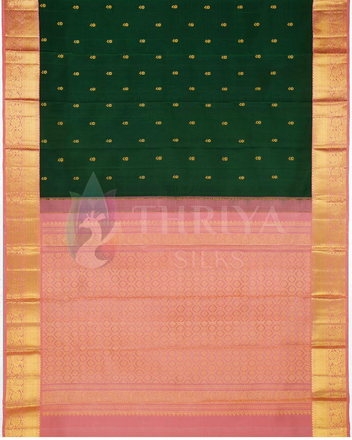 Full saree layout with green body, peach pallu, and gold zari detailing from Thriya Silks