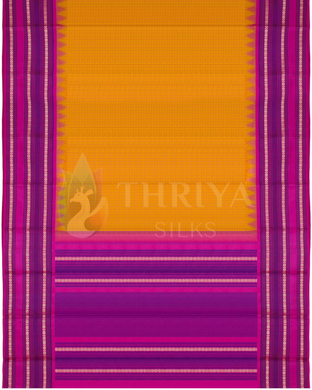 Full layout of yellow Kanjivaram silk saree featuring bold pink pallu and temple design