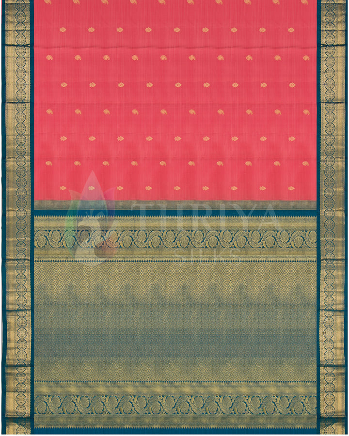 Full view of coral pink saree with teal pallu and gold zari detailing throughout