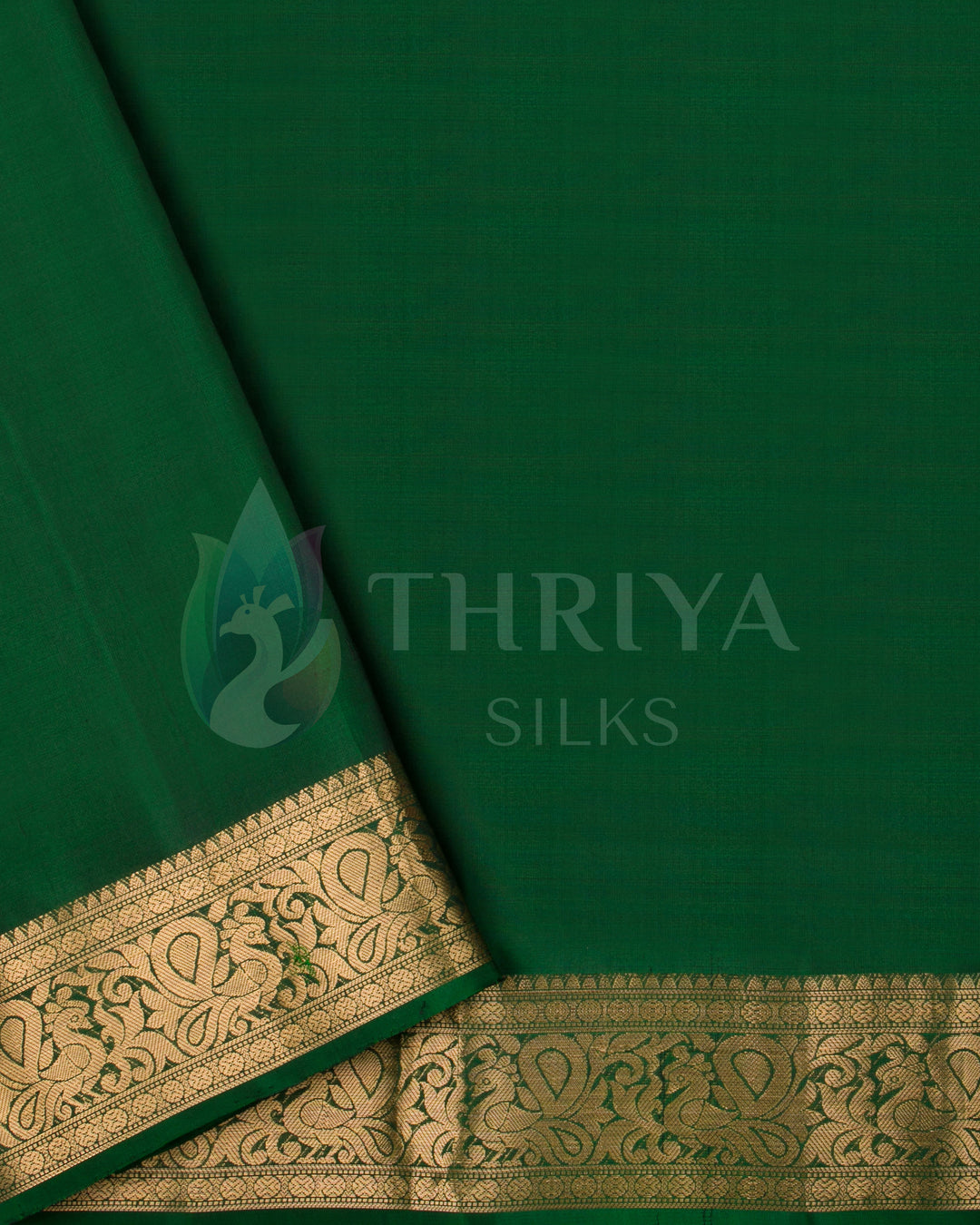 Green blouse with intricate gold zari border for purple Kanjivaram saree